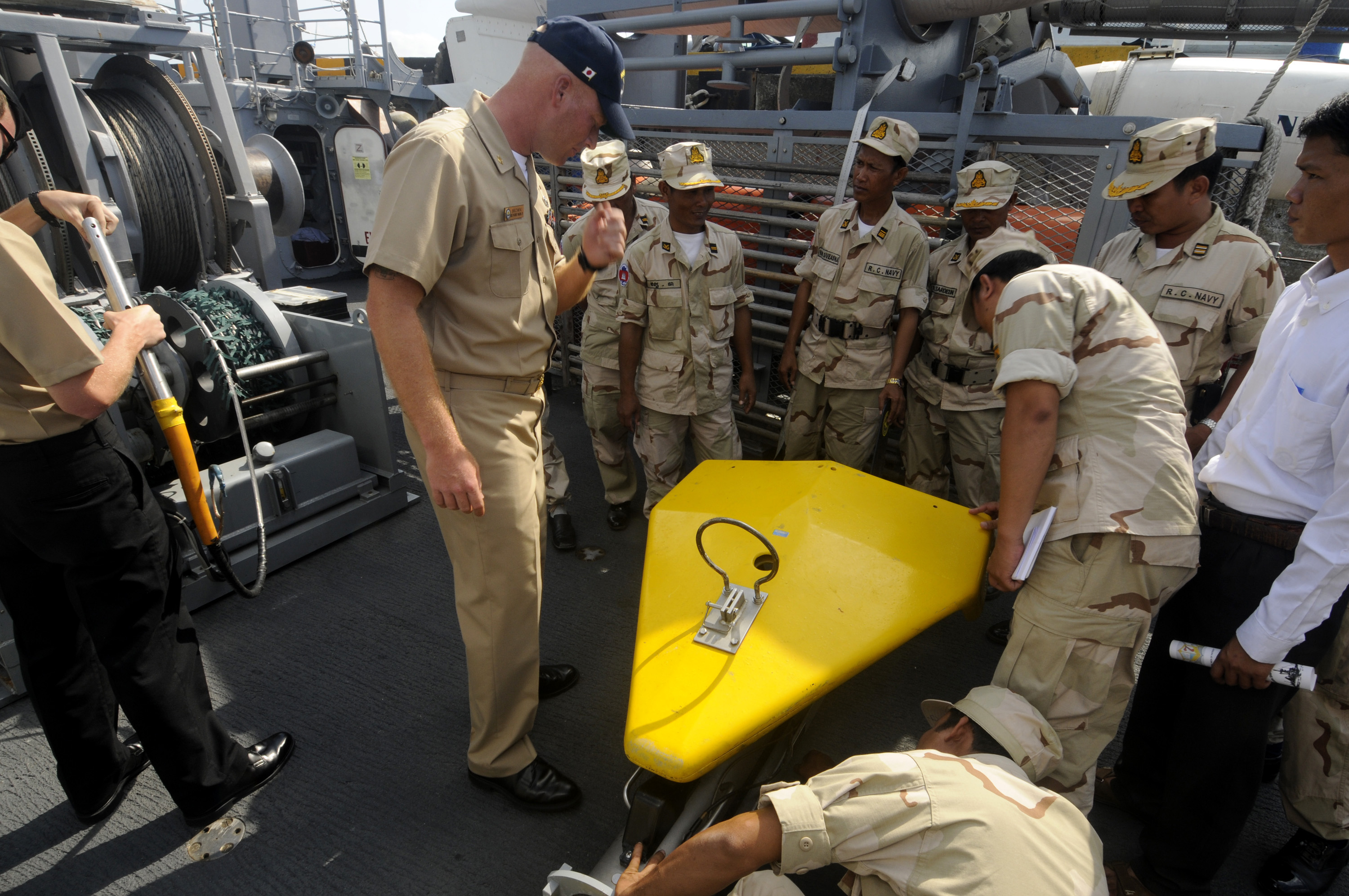 US Navy 100216-N-8335D-113 hief Mineman William Brown shows Royal Cambodian Navy officers a Klein side-scan sonar aboard the mine counter-measures ship USS Patriot (MCM 7)