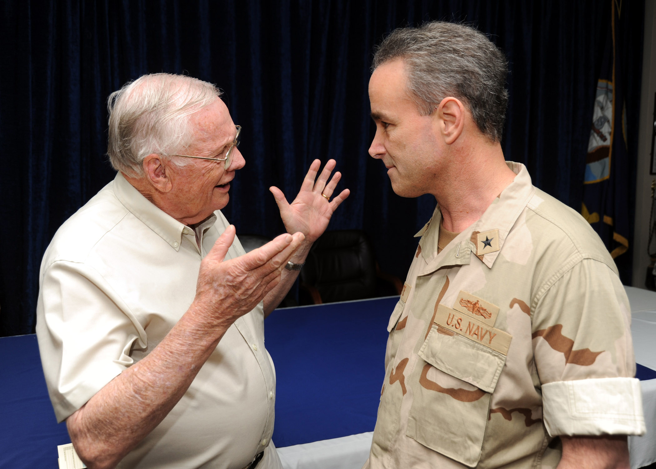 US Navy 101009-N-5429S-077 Former astronaut Neil Armstrong talks with Rear Adm. Charles Gaouette, deputy commander of U.S. Naval Forces Central Com