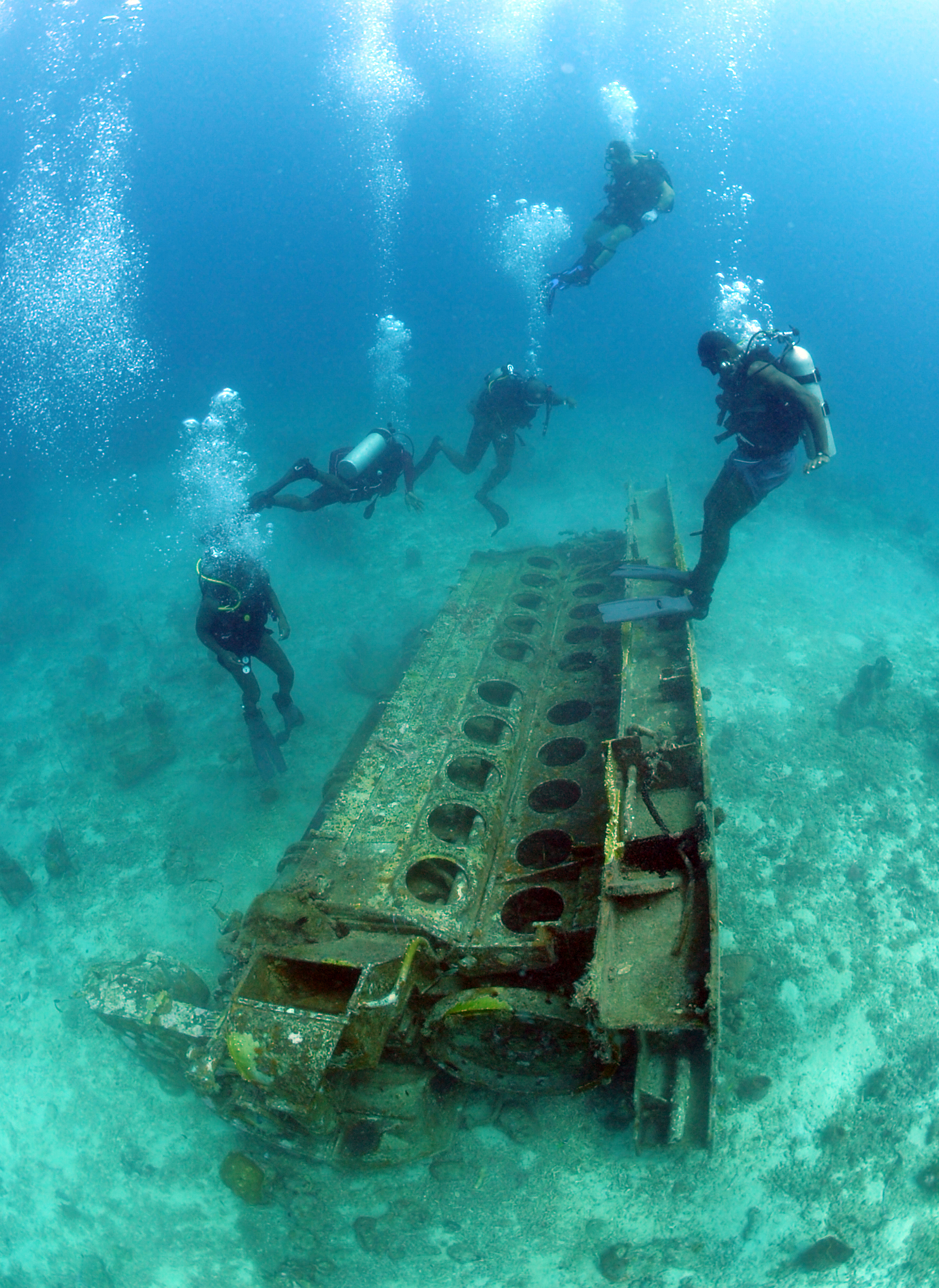 US Navy 110616-N-XD935-040 Divers dive onto a 22-ton engine block off the coast of Barbados