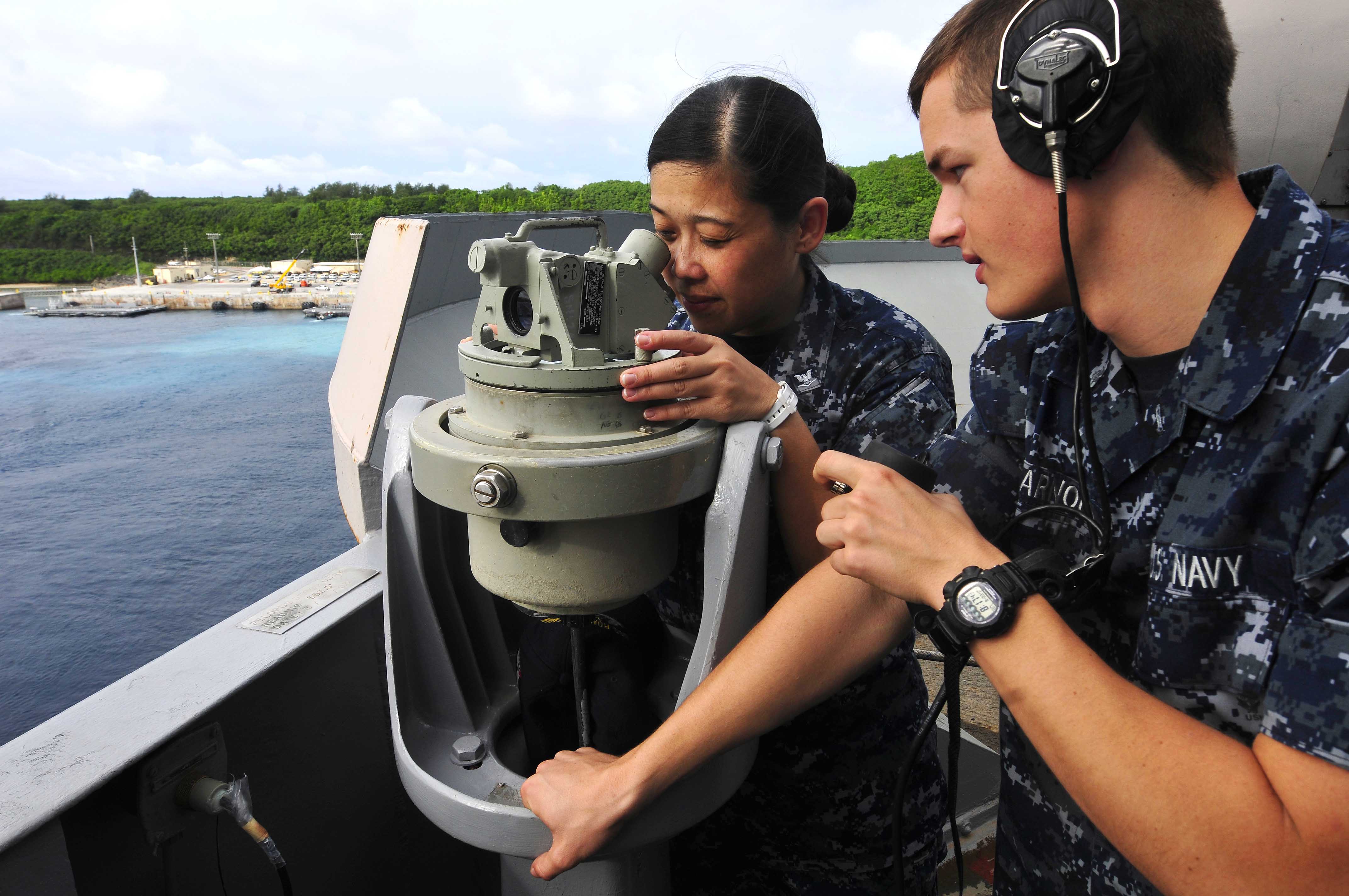 US Navy 110823-N-EE987-047 Sailors use a telescopic alidade to find relative bearing