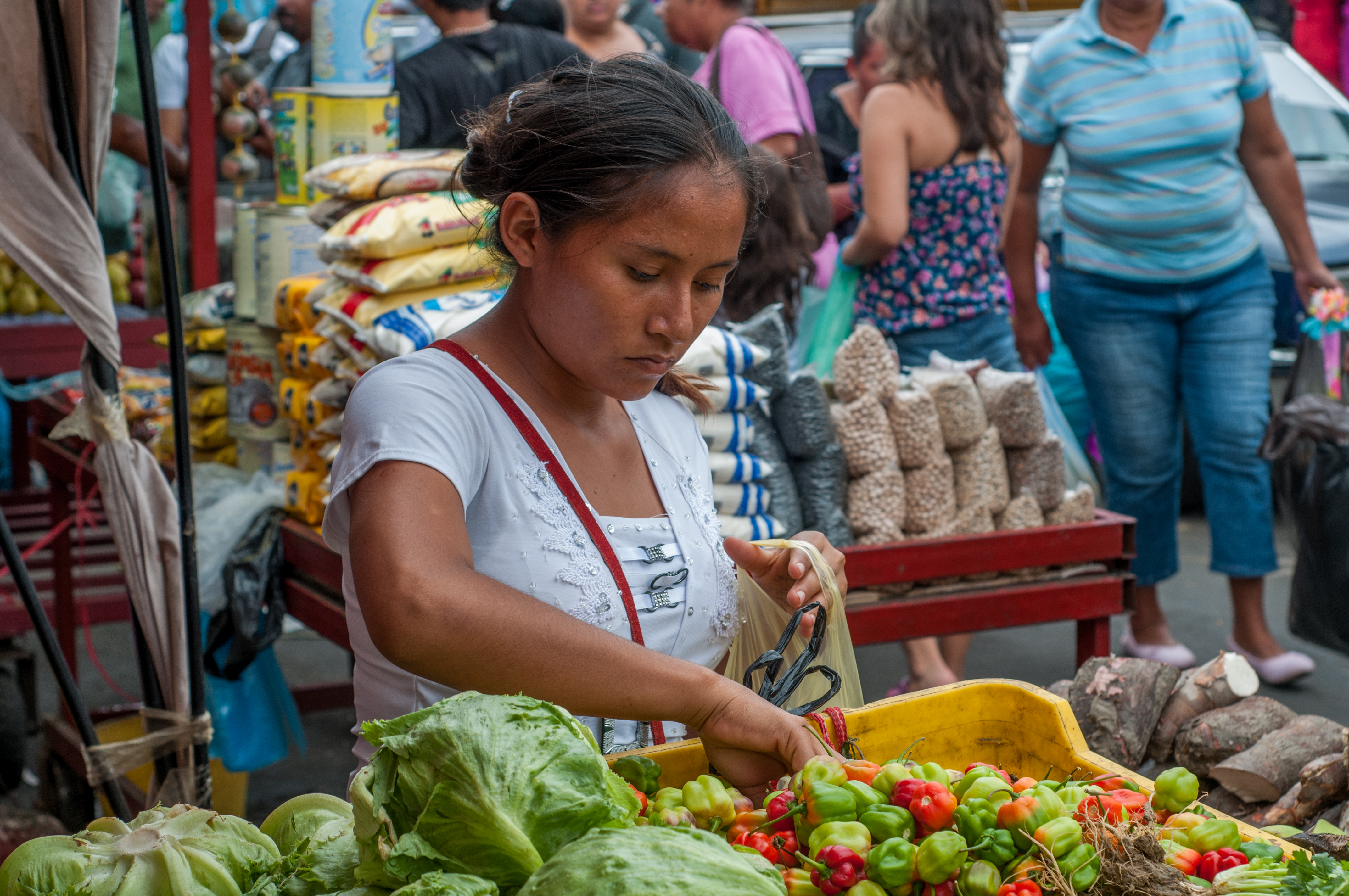 Woman buying peppers