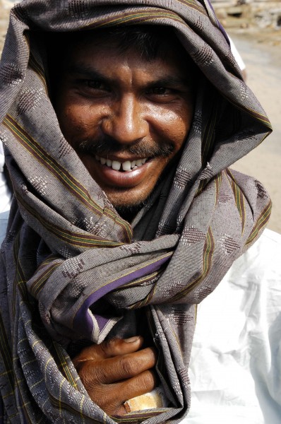 US Navy 050106-N-4166B-261 An Indonesian man near Meulaboh, Sumatra, Indonesia smiles with joy as the U.S. Navy delivers supplies in the area, in the wake of the devastating Tsunami that hit the region