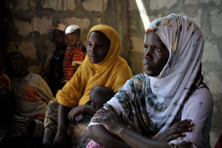 Women and their babies wait patiently at a medical clinic in Mogadishu, Somalia. At a clinic held at Jazeera Training Camp on April 6, patients come to a free medical clinic in order to receive (8633035417)