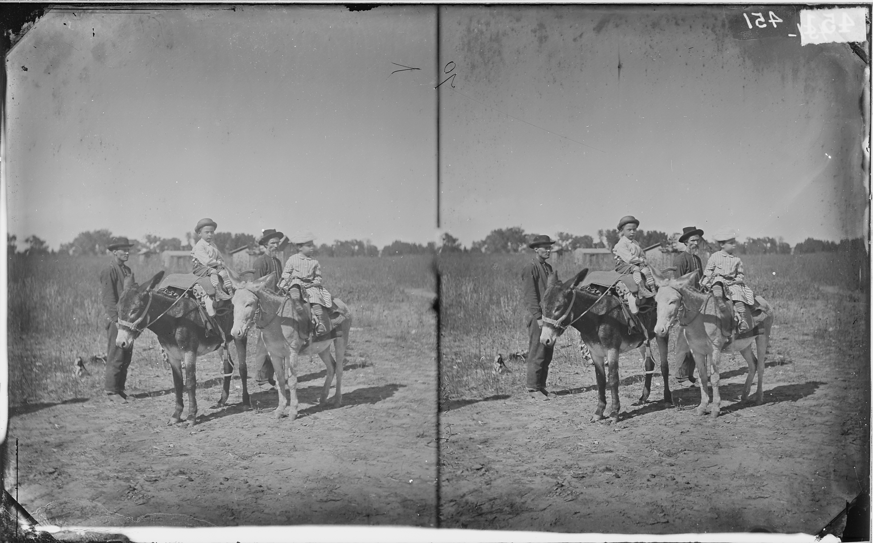 TWO CHILDREN ON DONKEYS - NARA - 524079