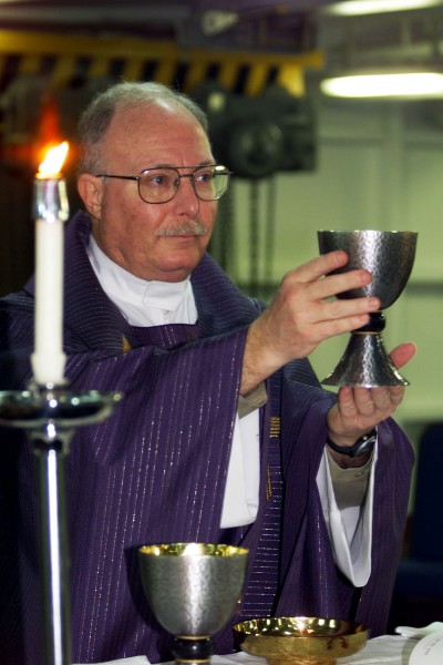 000326-N-6910B-501 Chaplain Conducts Catholic Services