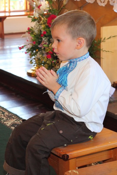 a young boy in a Catholic Church