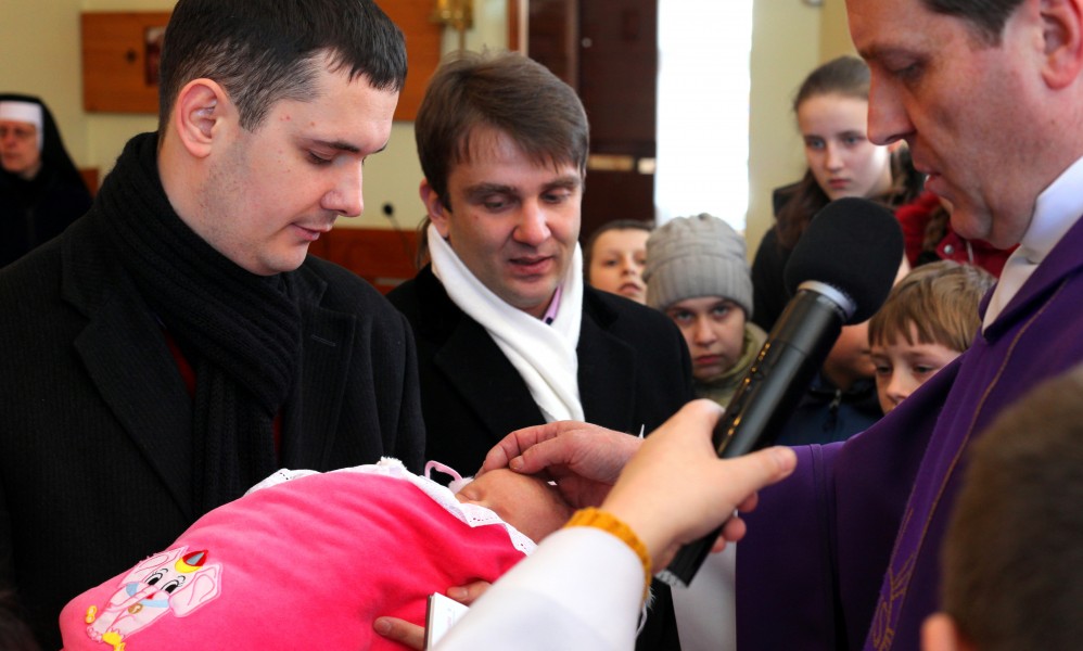 baptism of a baby girl in a Catholic church, picture 6