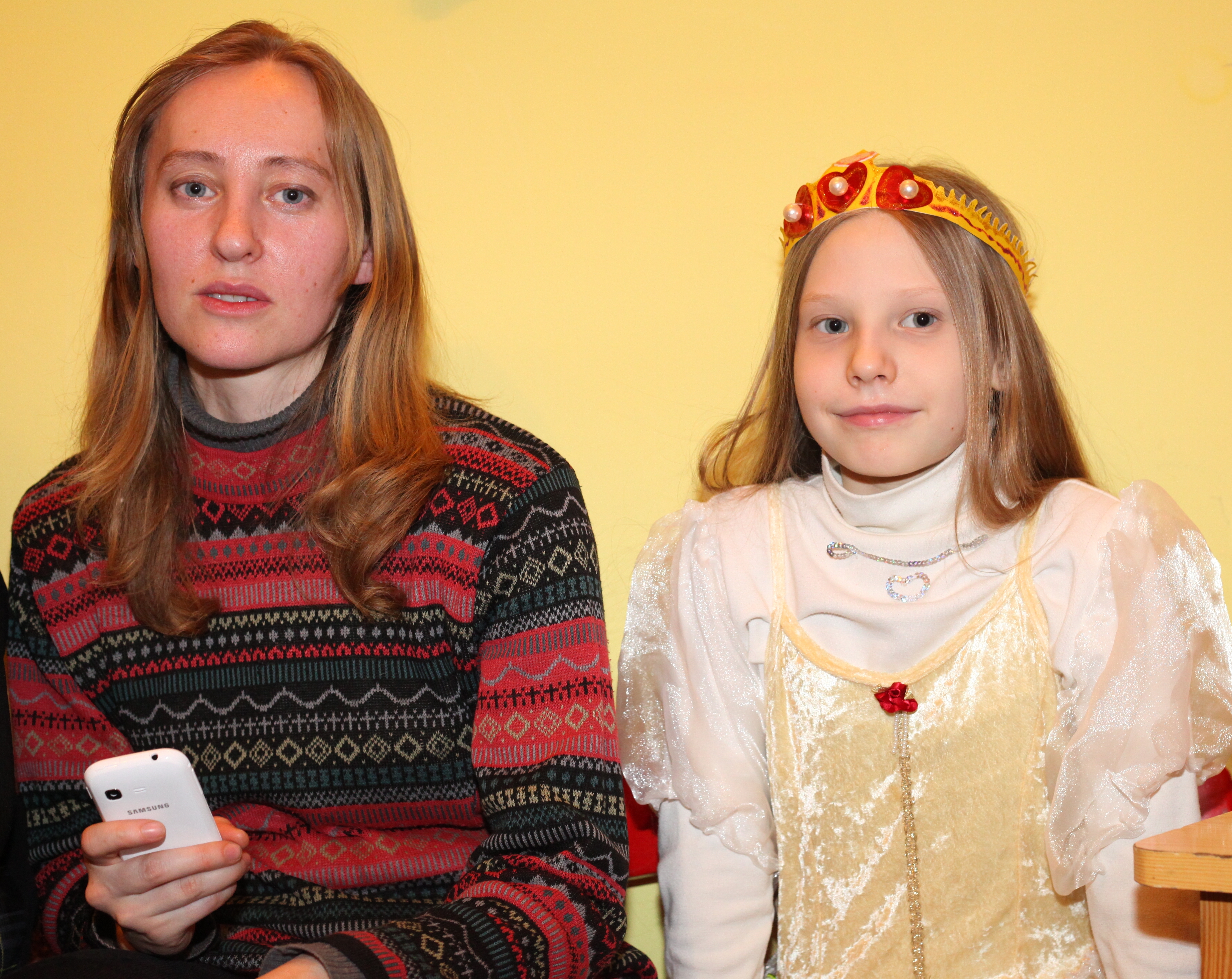 a beautiful blond woman with a beautiful blond girl in a Catholic kindergarten, photo 2