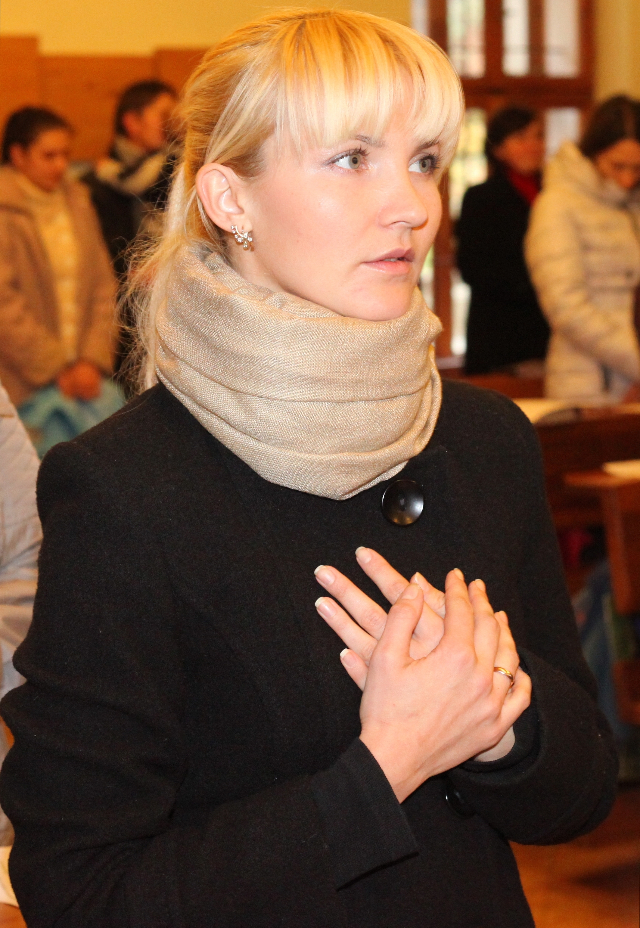 an amazingly tender and charming beautiful young blond Catholic woman in a Church, photo 2