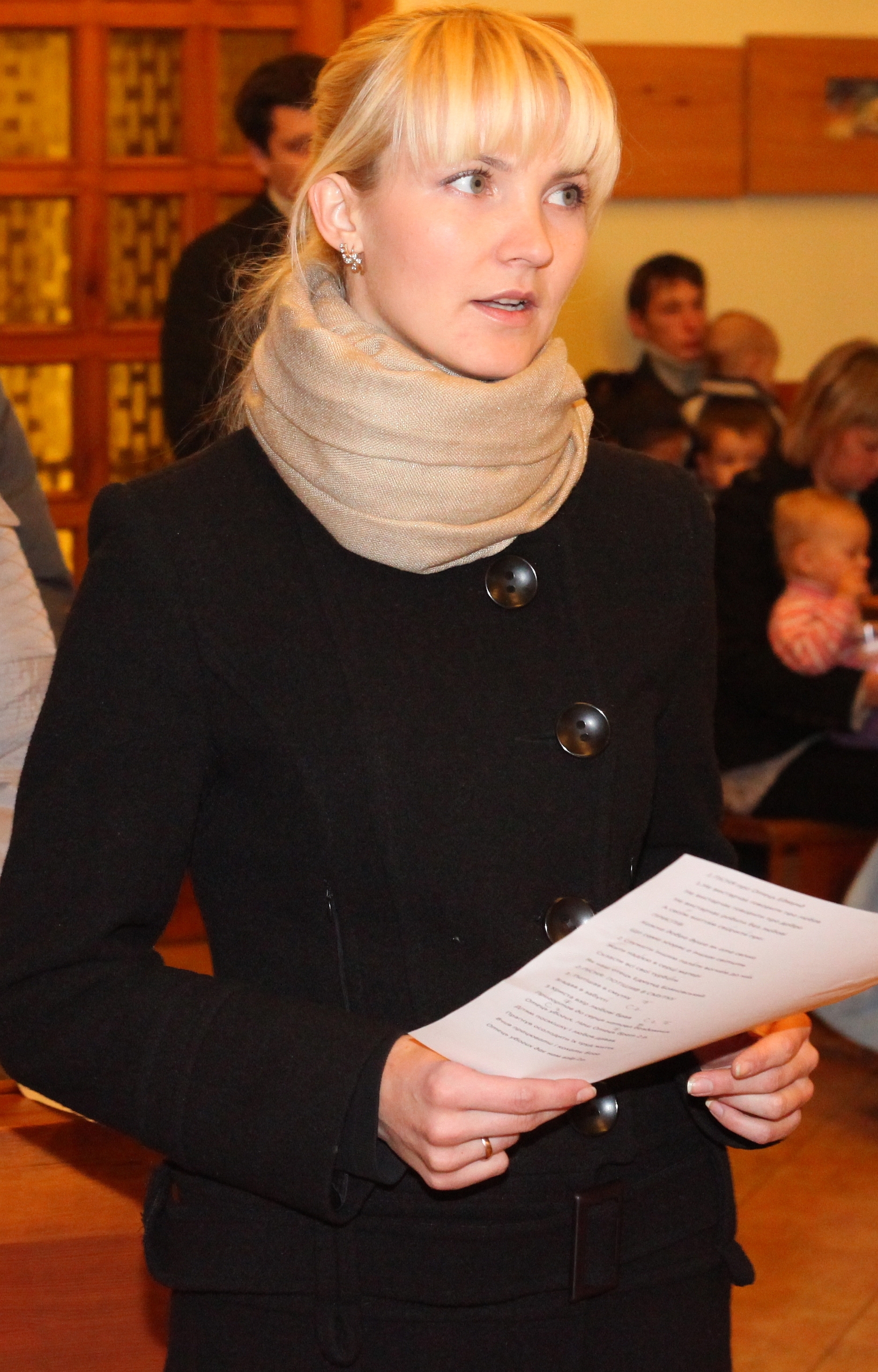 an amazingly tender and charming beautiful young blond Catholic woman in a Church, photo 4