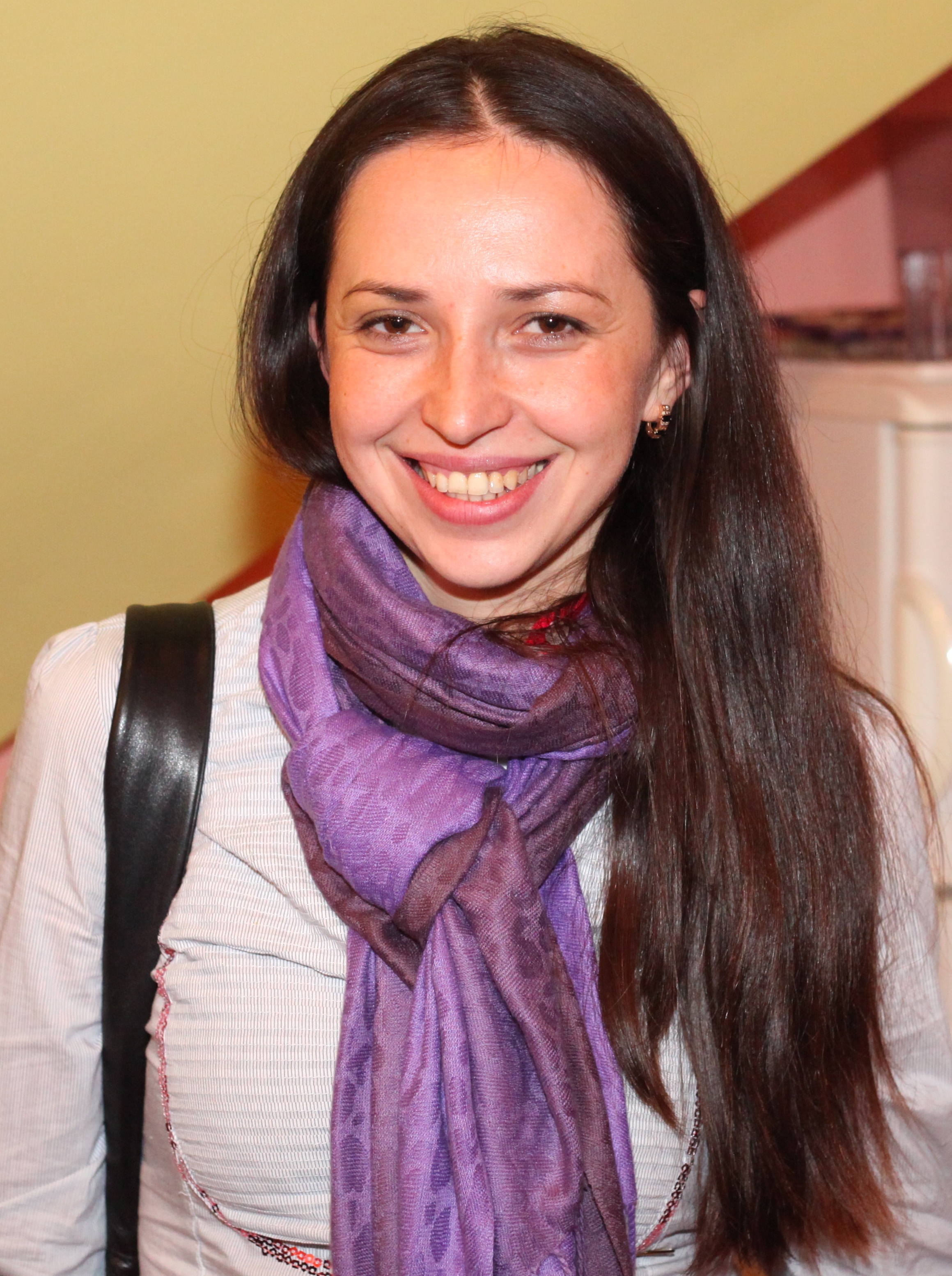 an amazingly attractive smiling charming beautiful young brunette Catholic woman in a Church, photo 3