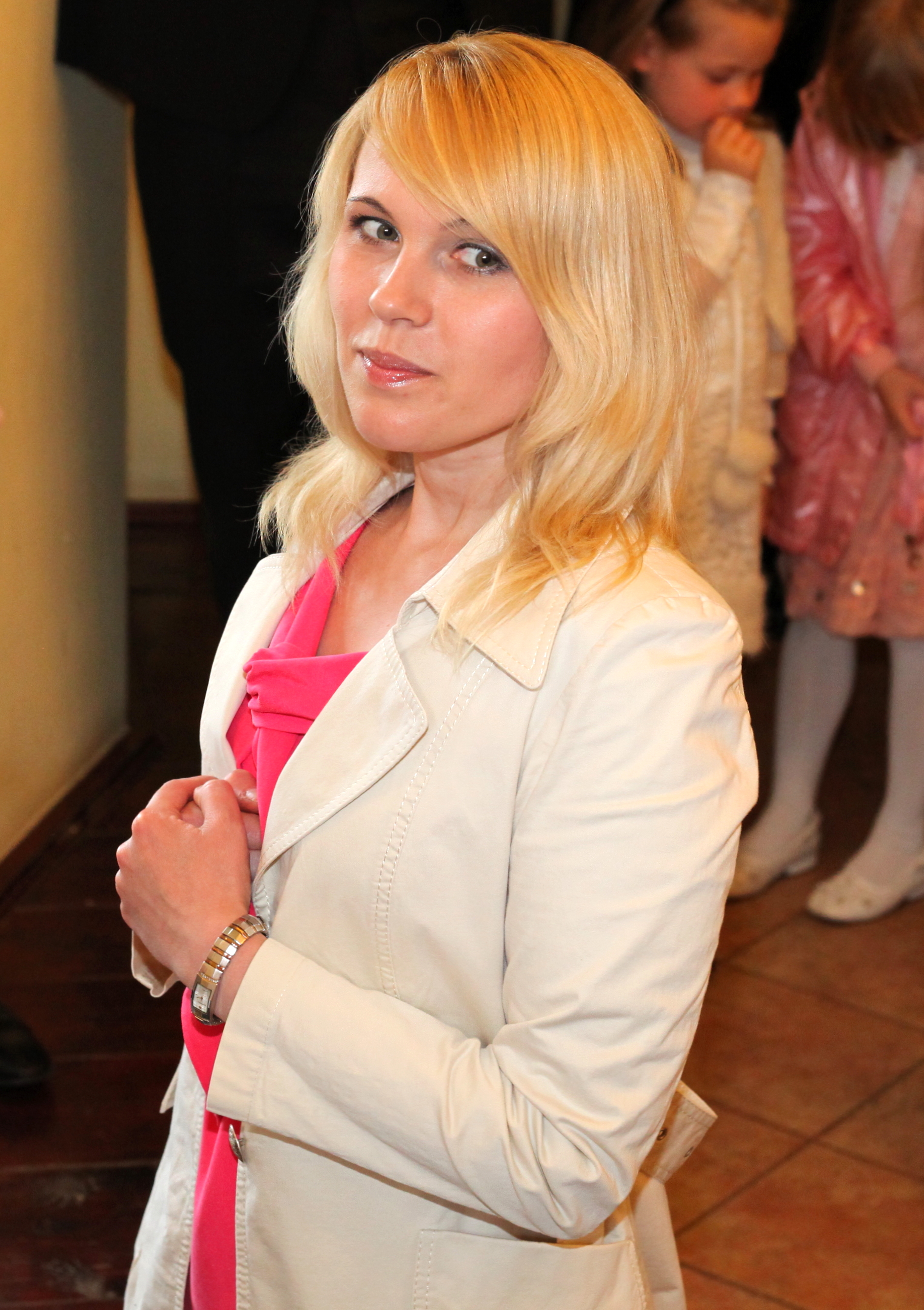 a cute blond Catholic woman taking Jesus Christ in a Holy Communion in May 2013, image 3 out of 3