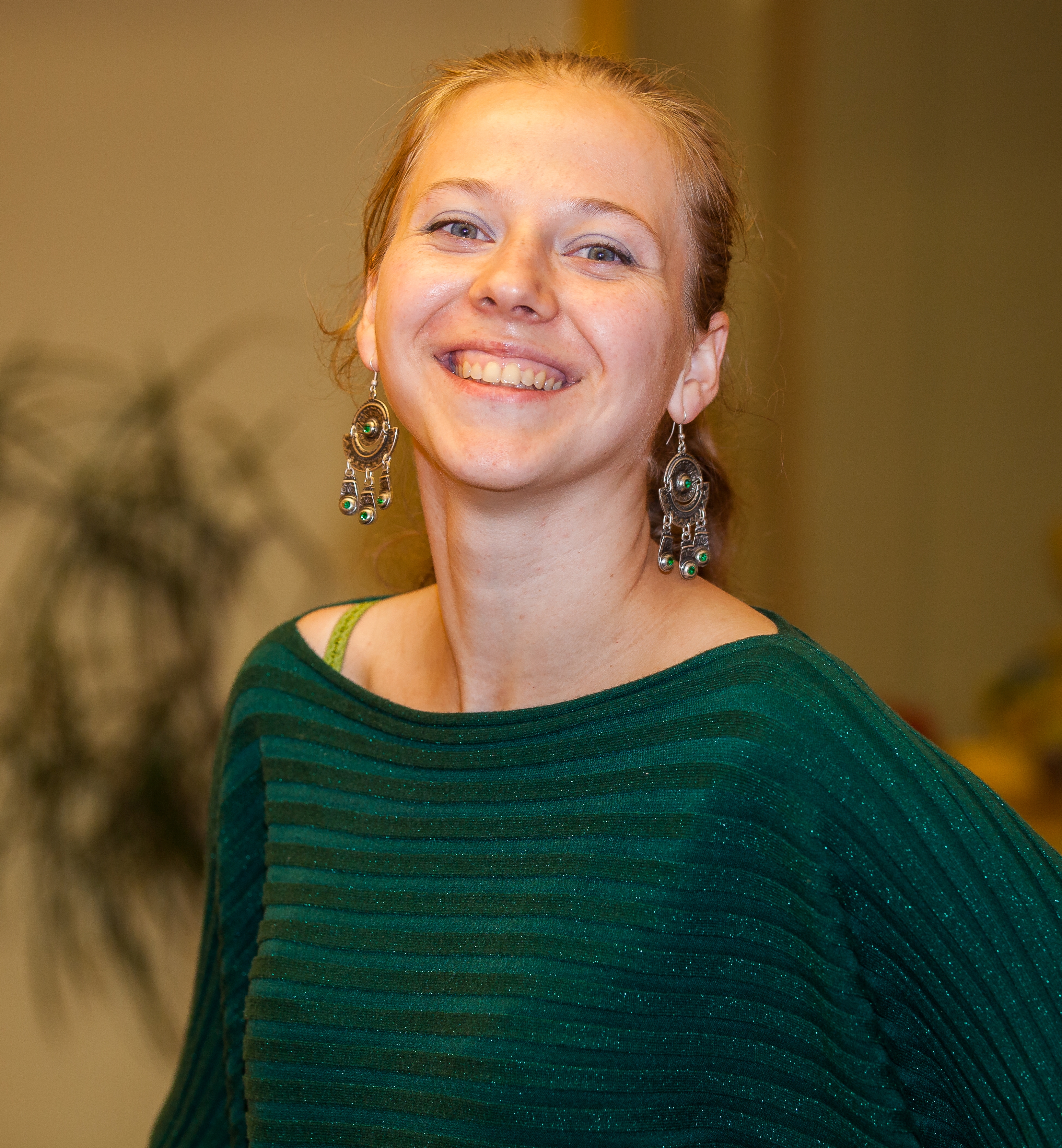 a fair-haired young smiling woman photographed in October 2013, picture 3/6