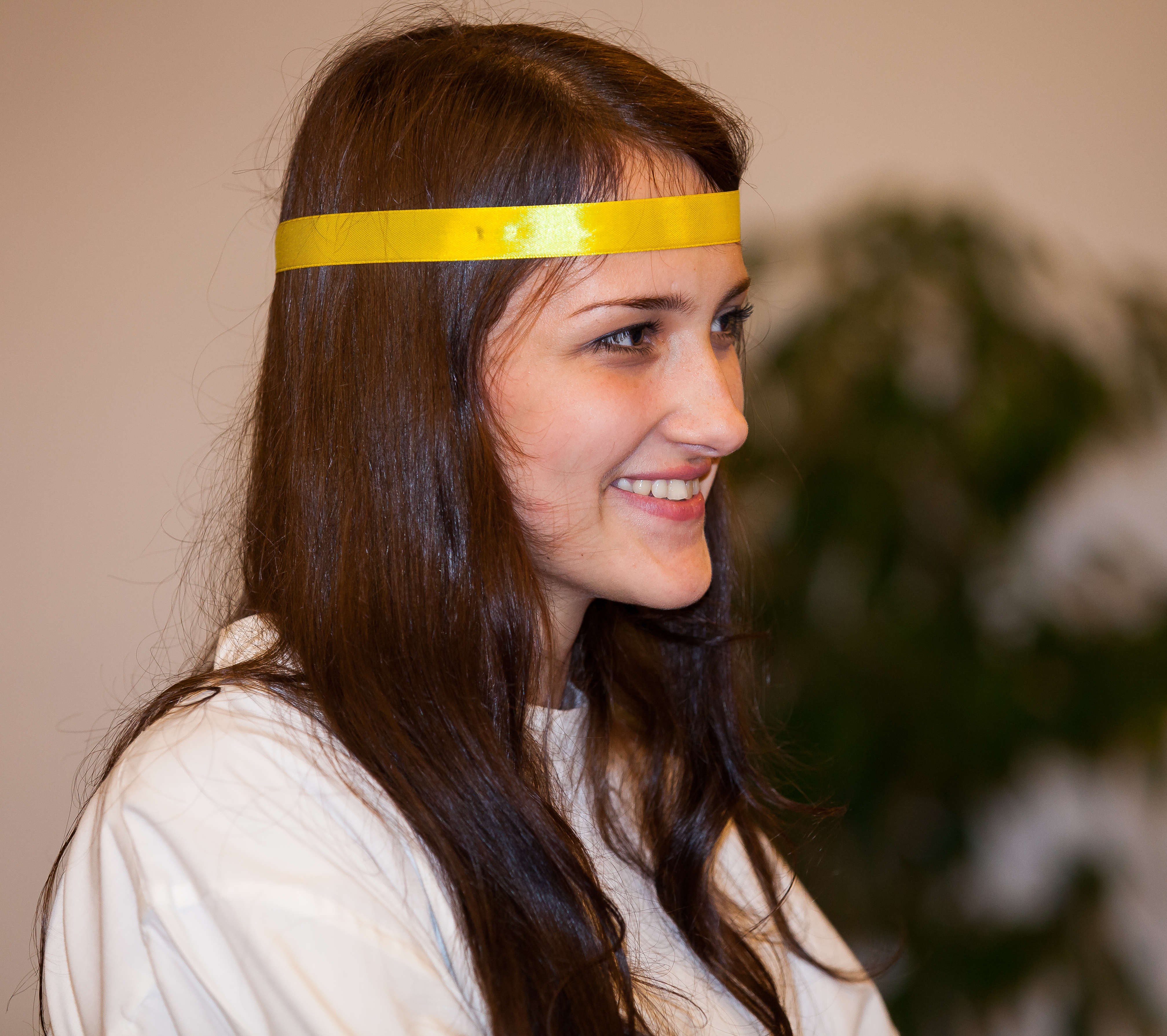 a young brunette Catholic woman in a church photographed in December 2013, picture 11