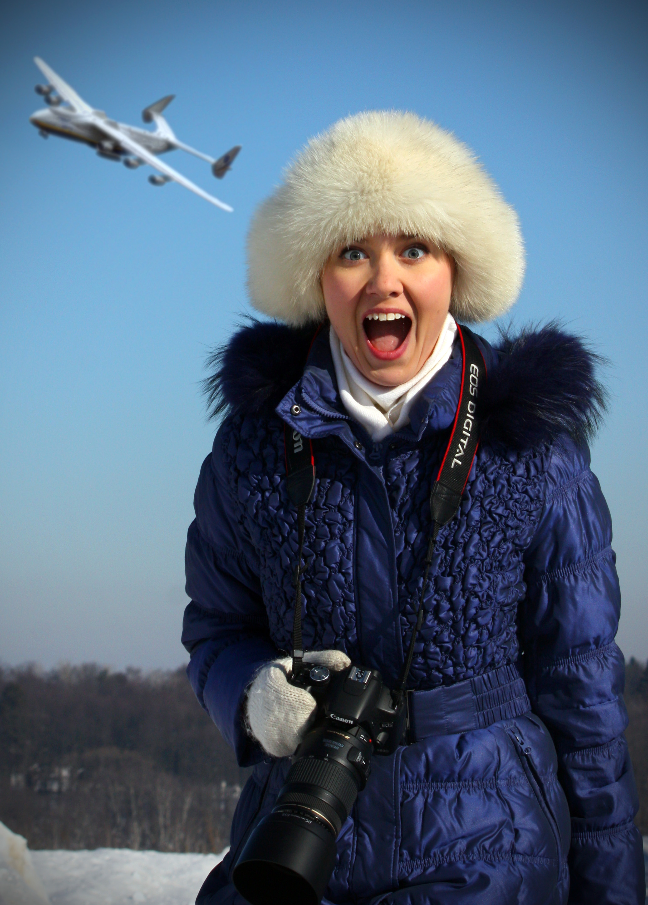 Female Russian photographer with the Antonov An-225 overhead