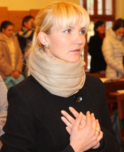 an amazingly tender and charming beautiful young blond Catholic woman in a Church, photo 3