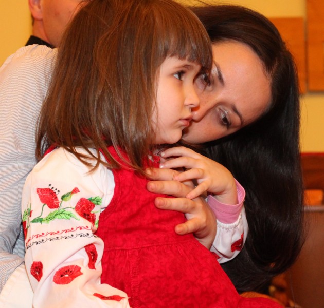 an amazingly attractive charming beautiful young brunette Catholic woman with her cute charming daughter in a Church, photo 6