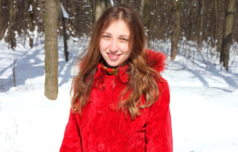 a charming beautiful attractive young Catholic woman in a snowy forest, photo 2