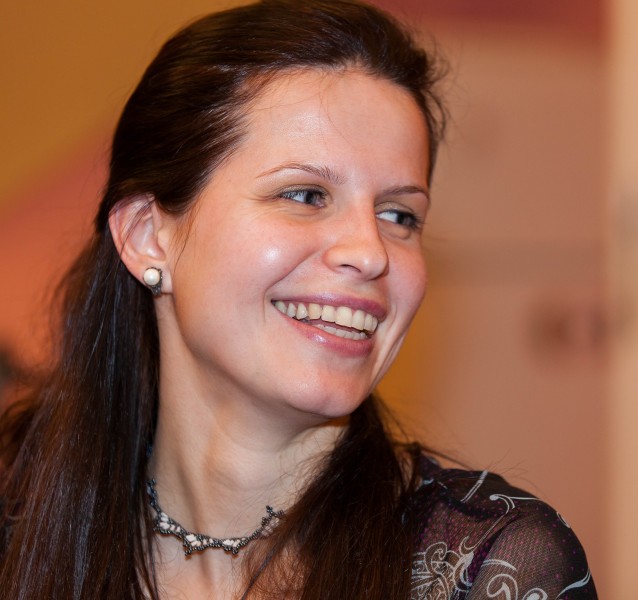 a young brunette Catholic woman photographed in December 2013, picture 3/11
