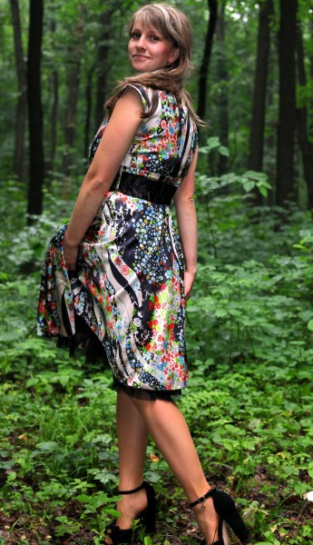 a young Catholic woman wearing a colorful dress in a forest in June 2013, portrait 6/9