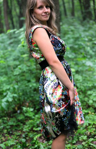 a young Catholic woman wearing a colorful dress in a forest in June 2013, portrait 9/9