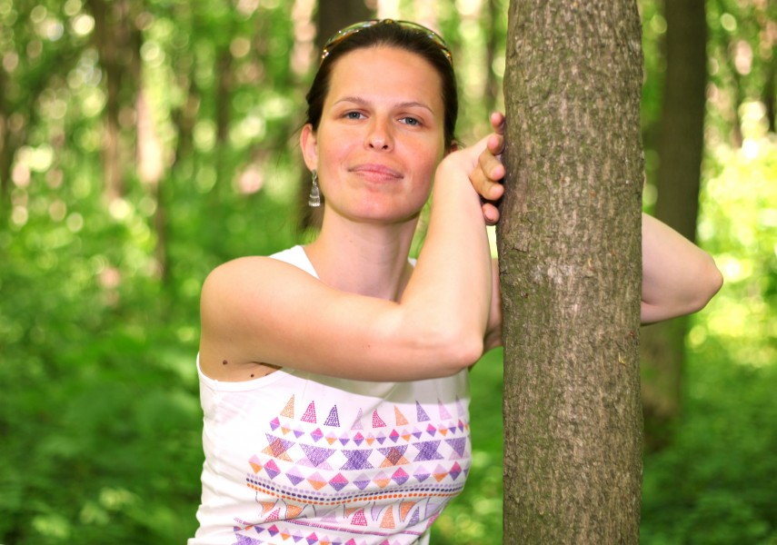 a beautiful brunette Catholic woman near a tree in May 2013
