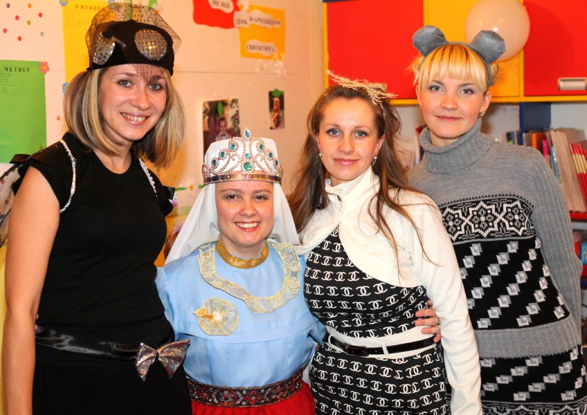 three dressed-up women and a nun in a Catholic kindergarten