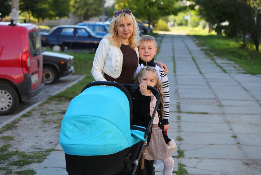a Catholic mother with her three kids in September 2013