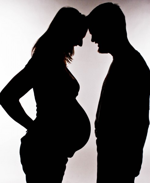 Silhouette or a pregnant woman and her partner-14Aug2011