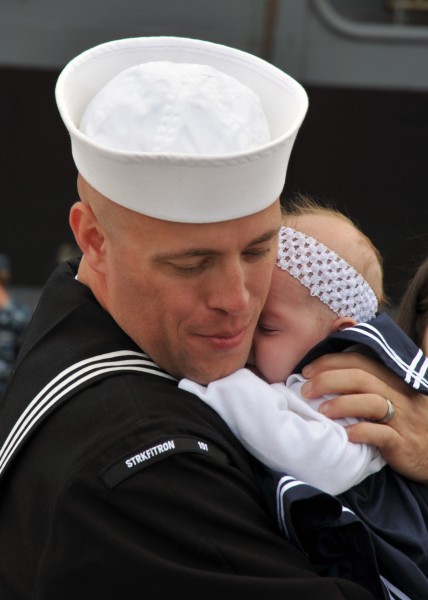 US Navy 110319-N-YB753-090 Aviation Structural Mechanic 1st Class Eric Anderson, assigned to Strike Fighter Squadron (VFA) 151, holds his newborn b