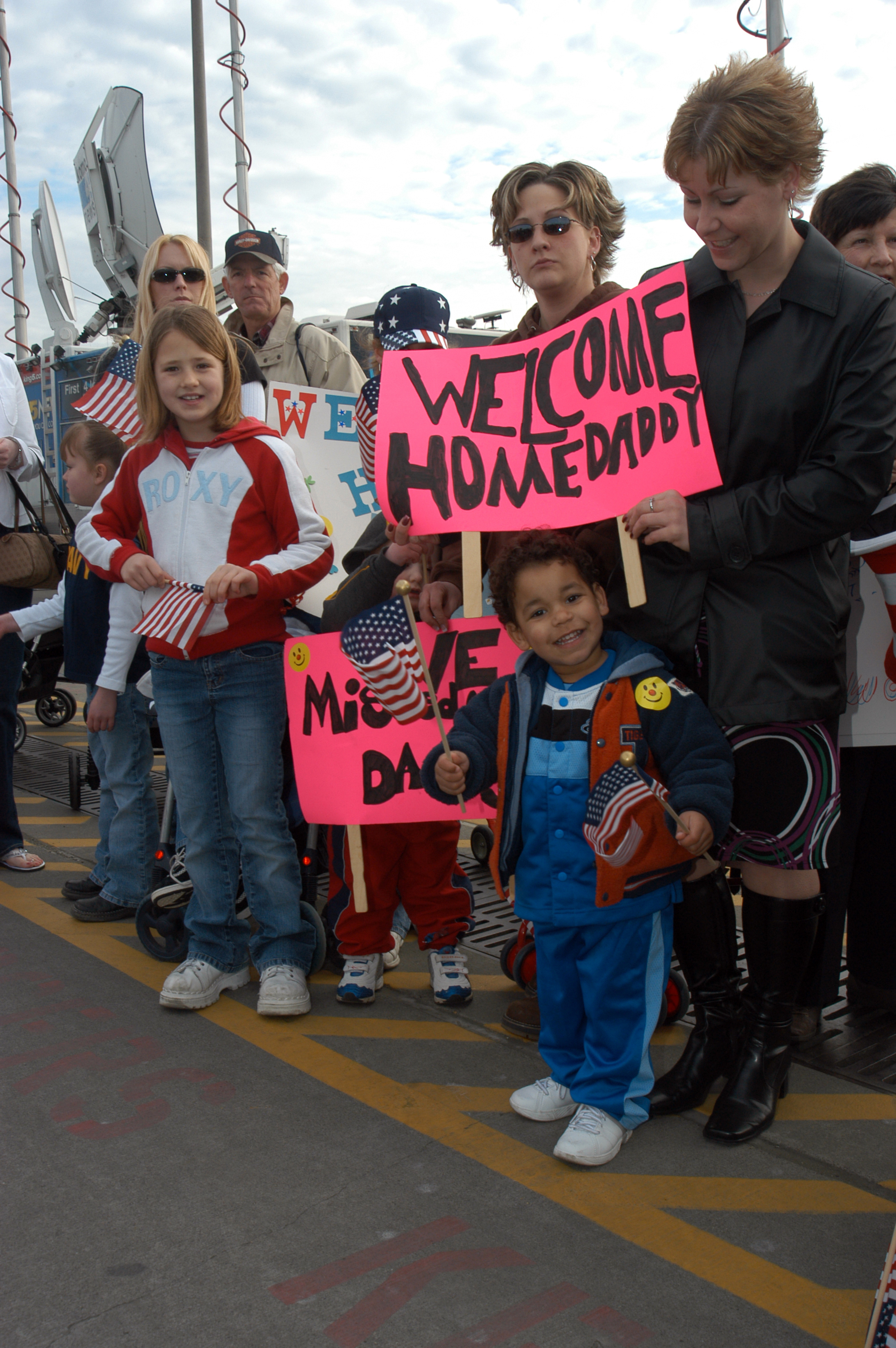 US Navy 050304-N-3390M-410 Hundreds of friends and family gather at the pier on board Naval Station Everett, Wash., to welcome home their loved ones from a deployment to the Western Pacific Ocean aboard the Nimitz-class aircraf