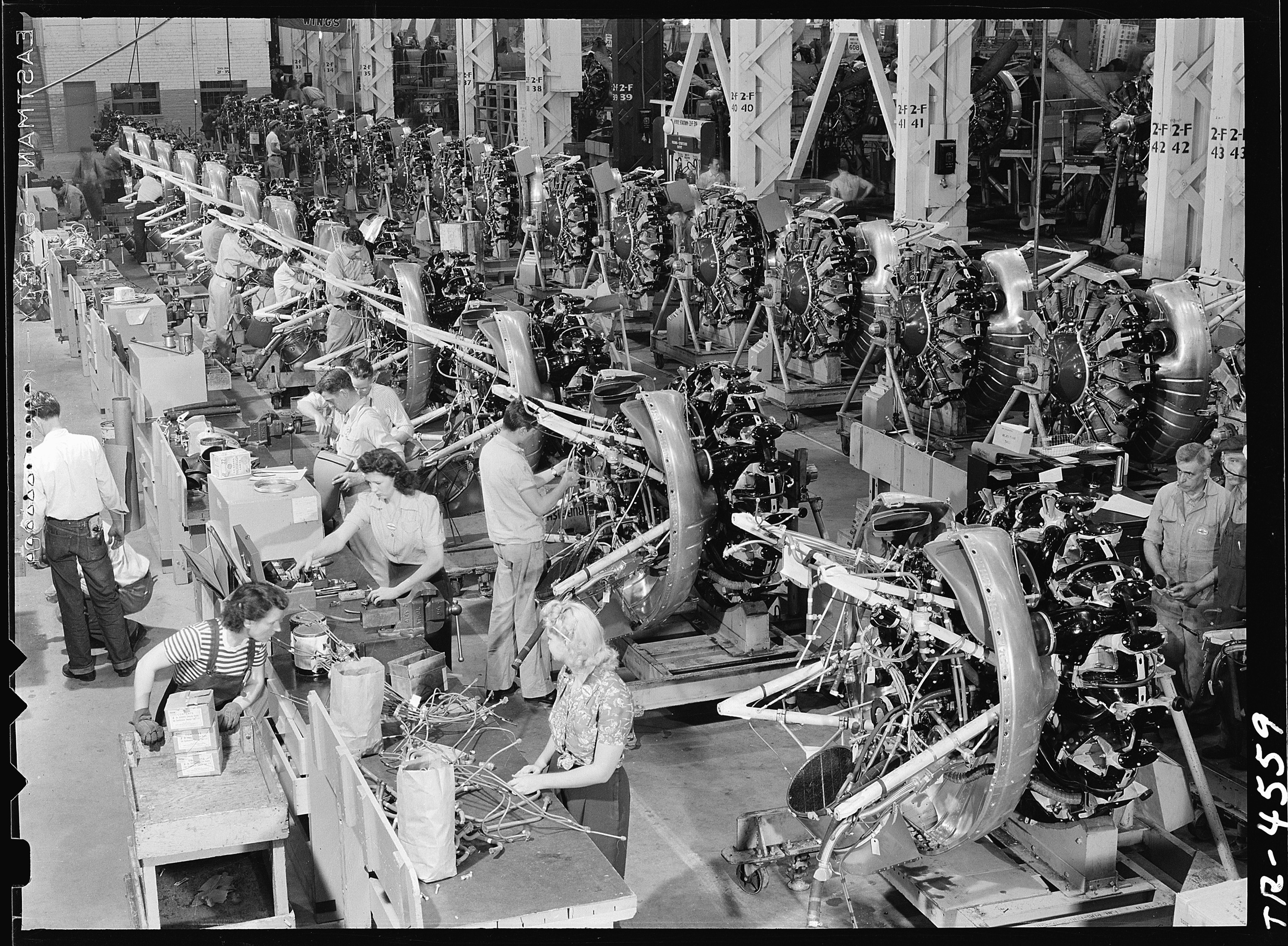 Inside the Douglas aircraft plant at El Segundo, Cal. Row on row the powerful engines that will drive SBD's on... - NARA - 520741