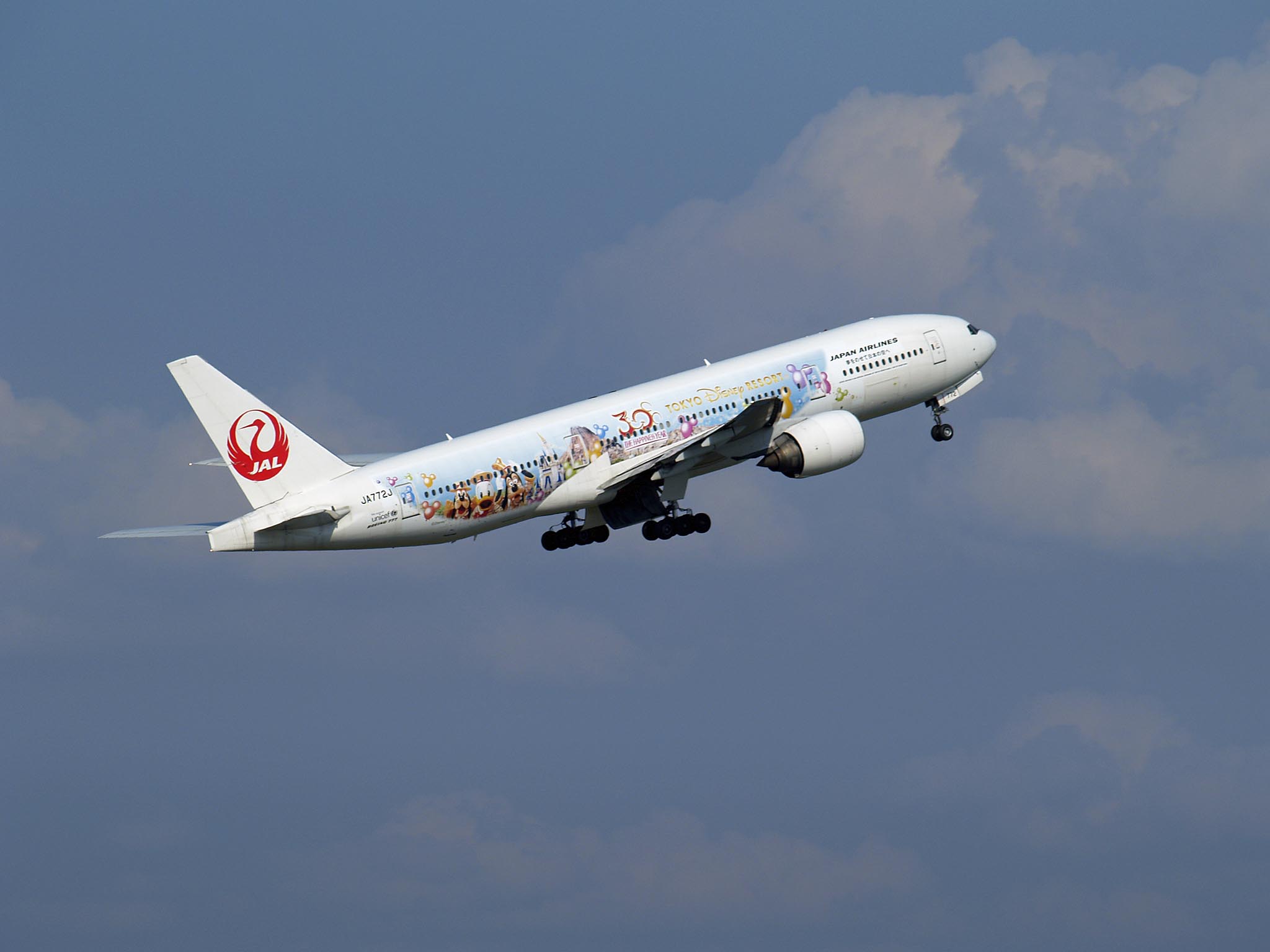 JAL JA772J Boeing 777-246 Happiness Express