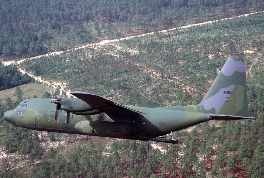 An Air Force Reserve C-130 Hercules transport aircraft approaches a drop zone during the Airlift Rodeo '90 container delivery system phase DF-ST-92-06090