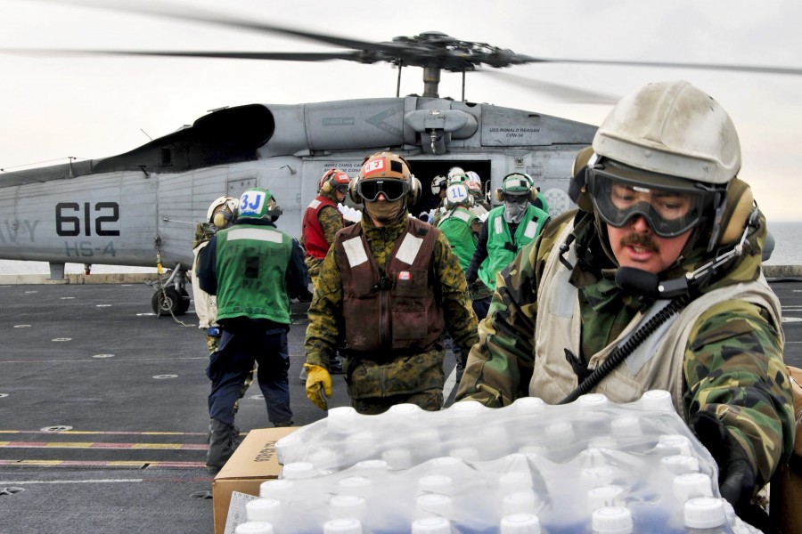 Defense.gov News Photo 110319-N-DM338-068 - U.S. sailors and Marines aboard the aircraft carrier USS Ronald Reagan load humanitarian assistance supplies onto an HH-60H Seahawk helicopter