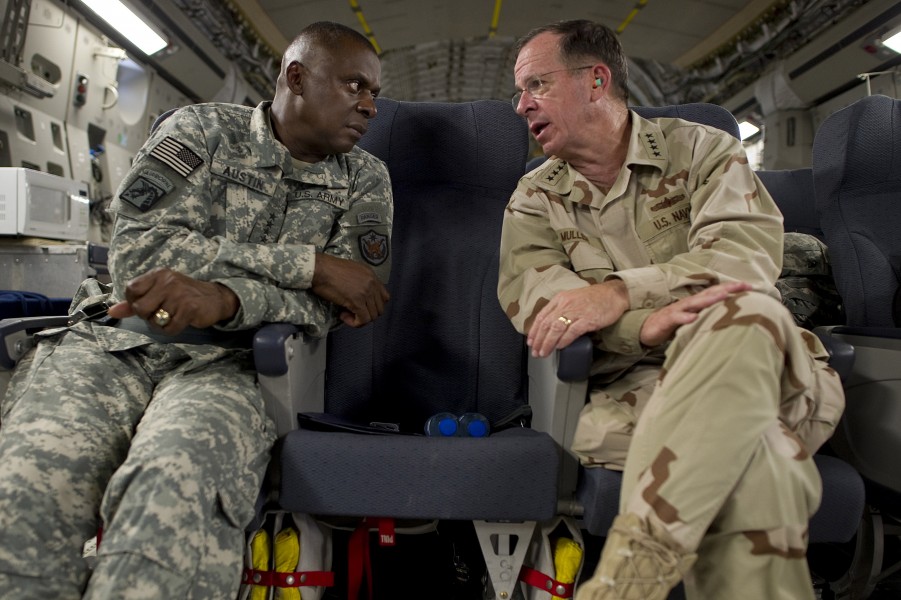 Defense.gov News Photo 110801-N-TT977-414 - Chairman of the Joint Chiefs of Staff Adm. Mike Mullen speaks with Commander of U.S. Forces-Iraq Gen. Lloyd Austin U.S. Army onboard a C-17