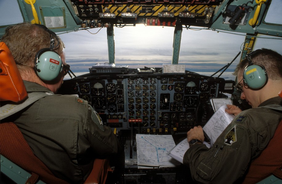 Maj. Steve O'Brien (left) and Capt. Carl Lojovich (right) fly a C-130 loaded with food and medicine to Sarajevo DF-ST-96-00297