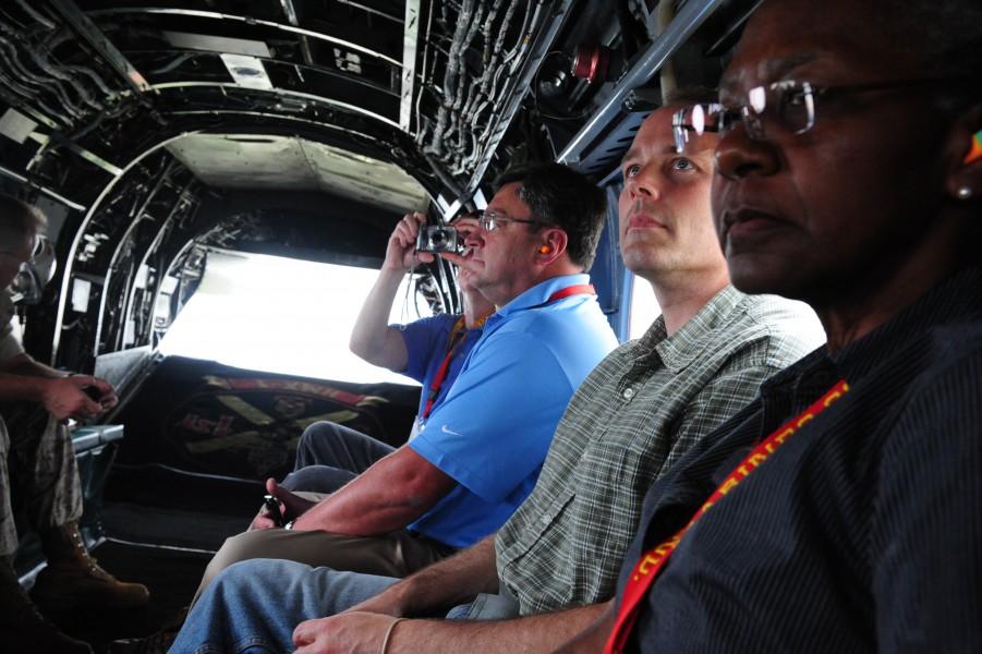 Members of the Marine Corps Executive Forum (MCEF) ride in a Marine Corps CH-46 Sea Knight helicopter as it flies over the National Capital Region, July 8, 2011 110708-M-KS211-108