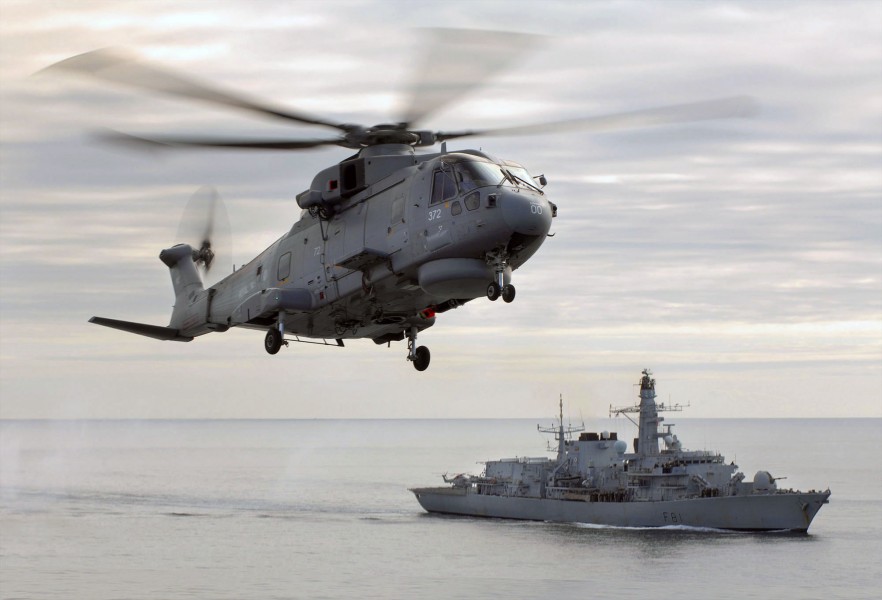 Merlin helicopter hovers over HMS Sutherland MOD 45147560