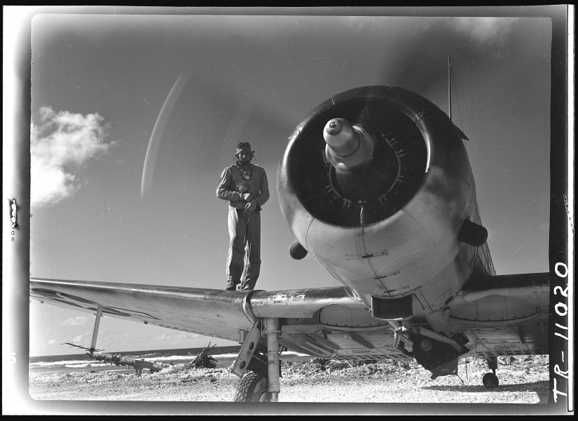 Pilot of VMSV-231 at Majuro Island, Capt. John F. Adams, USMC on the wing of his plane. - NARA - 520718