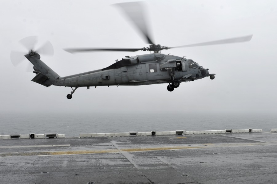 U.S. Navy helicopter landing on a ship after Sewol rescue operation