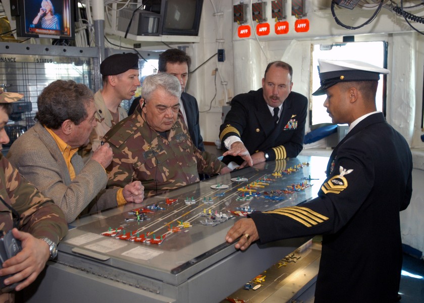 US Navy 040326-N-6187M-001 Captain E. C. Neidlinger, Commanding Officer, USS Enterprise (CVN 65) (right), briefs visiting dignitary General-Major Ismail Ergashev on flight deck operations