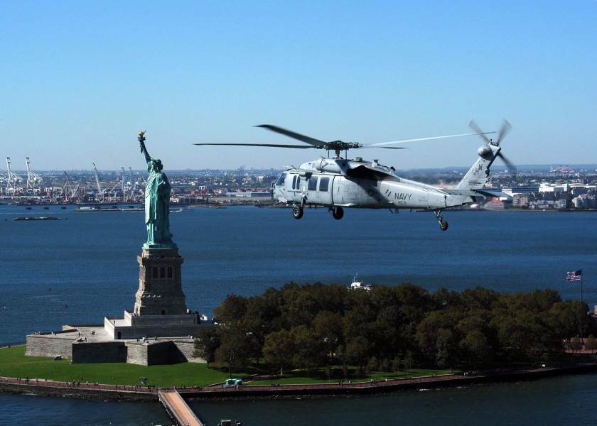US Navy 041012-N-6920A-001 An MH-60S Knighthawk flies near the Statue of Liberty during NATO Standing Naval Force Atlantic (SNFL) 2004 exercises