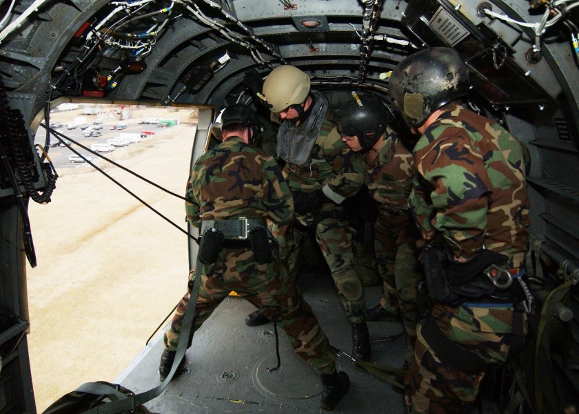 US Navy 050216-N-4374S-002 Sailors assigned to Explosive Ordnance Disposal Mobile Unit Two (EODMU-2), prepare to repel out of a UH-3H Sea King helicopter