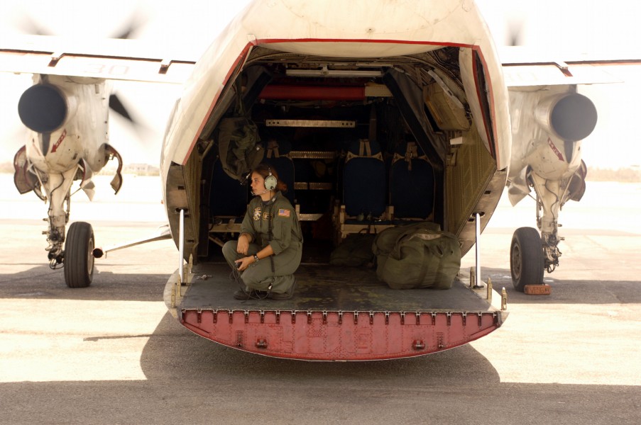 US Navy 050515-N-4309A-112 Aviation Ordnanceman 3rd Class Cira Nehring conducts final checks on a C-2A Greyhound, assigned to the Providers of Fleet Logistics Support Squadron Three Zero (VRC-30)