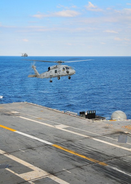 US Navy 100113-N-4774B-860 SH-60F Sea Hawks assigned to the Red Lions of Helicopter Squadron (HS) 15 land aboard the Nimitz-class aircraft carrier USS Carl Vinson (CVN 70)