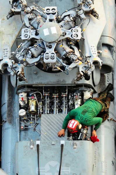 US Navy 100222-N-7939W-063 A sailor assigned to the Indians of Helicopter Anti-Submarine Squadron (HS) 6 performs maintenance on an SH-60F Sea Hawk helicopter aboard the aircraft carrier USS Nimitz (CVN 68)