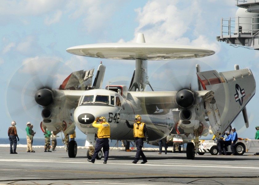 US Navy 100313-N-9793B-042 ailors assigned to the air department of the aircraft carrier USS George H.W. Bush (CVN 77) direct an E-2C Hawkeye
