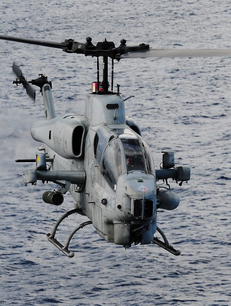 US Navy 100617-N-7948R-175 A Marine pilot assigned to the 15th Marine Expeditionary Unit (15th MEU) flies an AH-1W Super Cobra during flight operations aboard the amphibious assault ship USS Peleliu (LHA 5)
