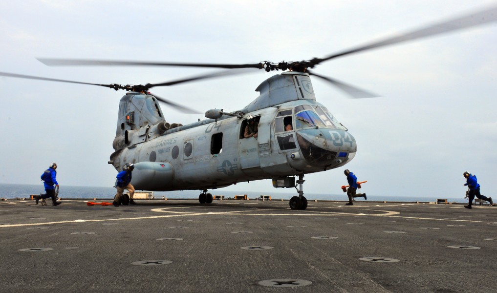 US Navy 100911-N-7948R-114 Helicopter is chained on the flight deck of USS Pearl Harbor